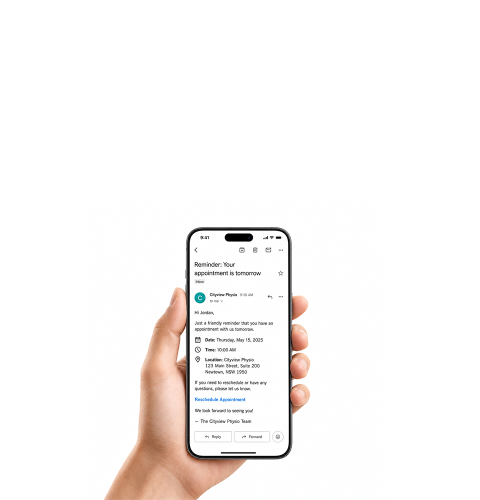 A reminder email open on a phone held in one hand